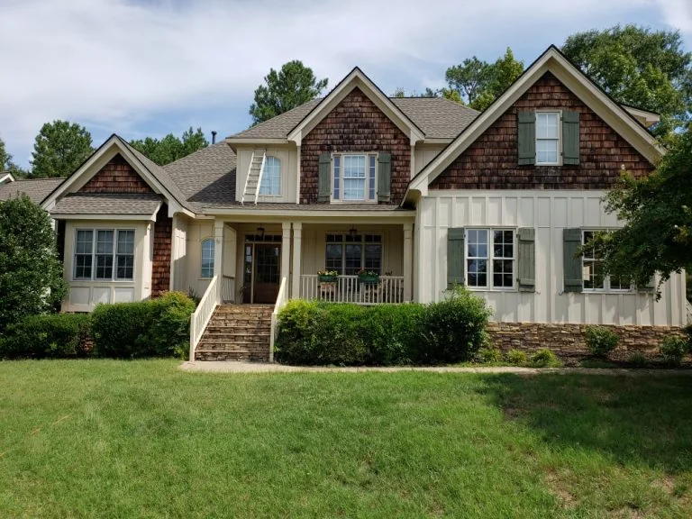 Gutter work on a detailed residential exterior